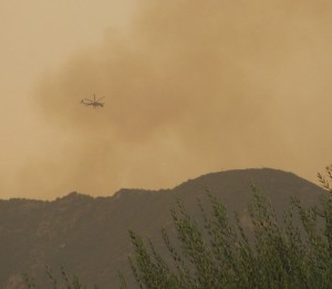Helicopter putting out a fire. Symbolic of puting out the financial fires in your life.